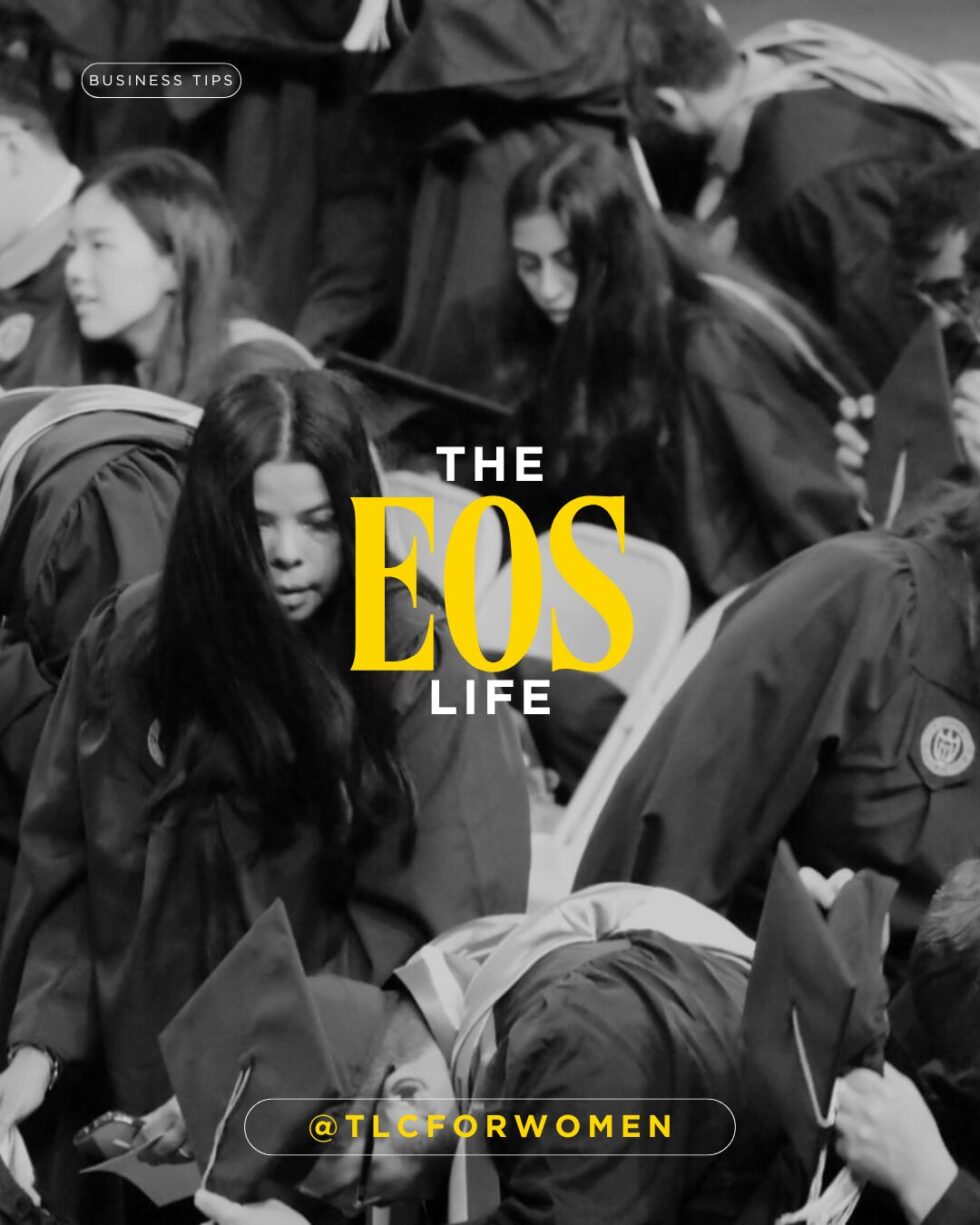image of a woman having just graduated. She's wearing a cap and gown.